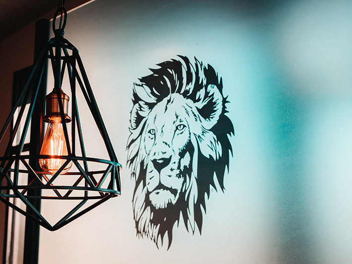 Lion's head logo on wall